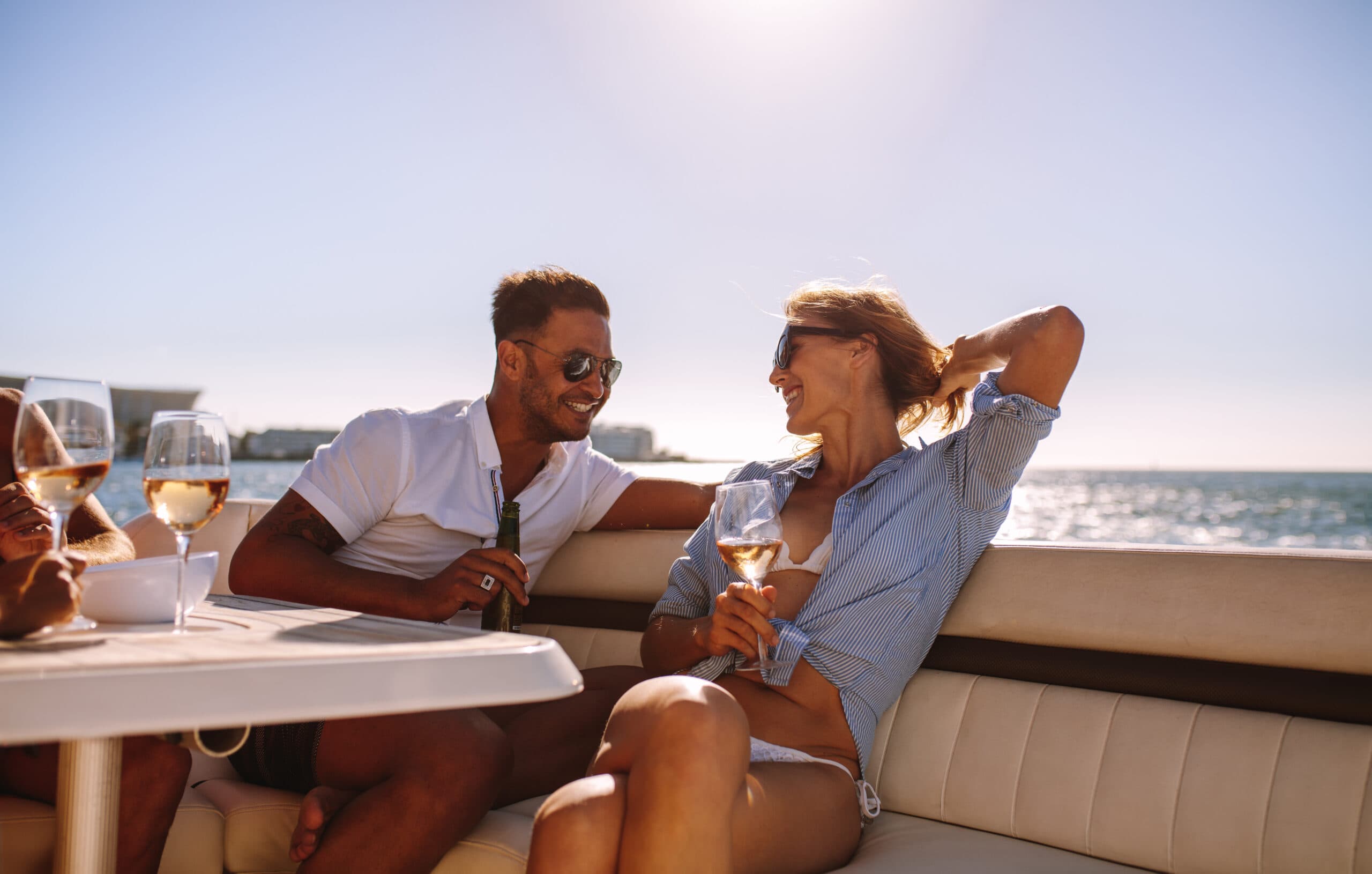Guests relaxing together aboard a yacht